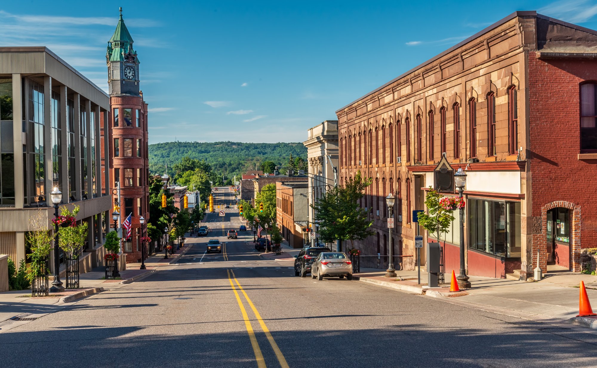 Downtown Marquette Michigan with historic clock tower and American flags
